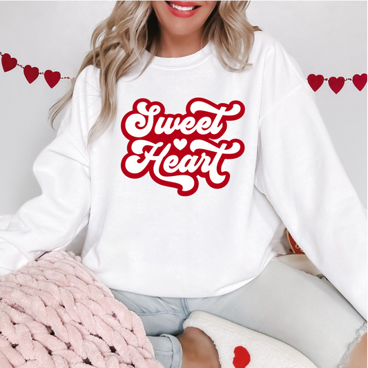 Front View of a white sweatshirt with red letters spelling out "sweet heart"