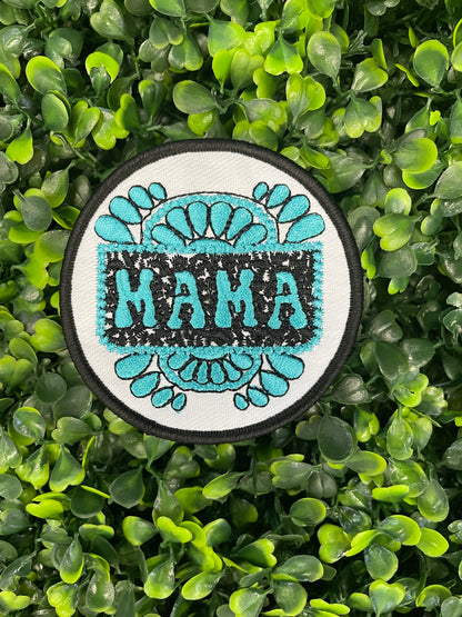 Circular patch with 'MAMA' text on a green leafy background