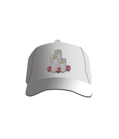 A white baseball cap with an iron-on patch featuring candles and roses design on the front.
