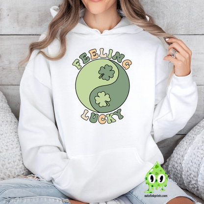 Front view of a white hoodie with the text 'FEELING LUCKY' and a graphic of a yin-yang symbol with clovers on both sides.