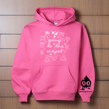A pink hoodie with white text and graphics related to a bride and wedding chapel.
