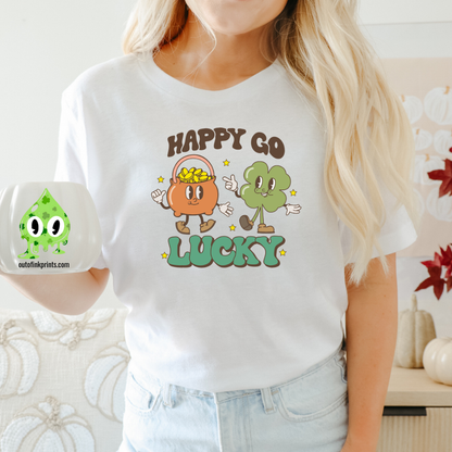 A person wearing a white 'Happy Go Lucky' t-shirt with cartoonish characters and text on it, suitable for St. Patrick's Day celebrations.