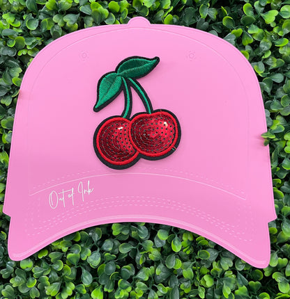 Sequins cherry patch with a leafy backdrop and a pink hat template