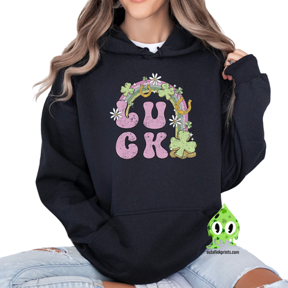 Front view of a black hoodie with a graphic print that includes the word 'LUCK' and elements representing Irish culture, such as shamrocks and gold.