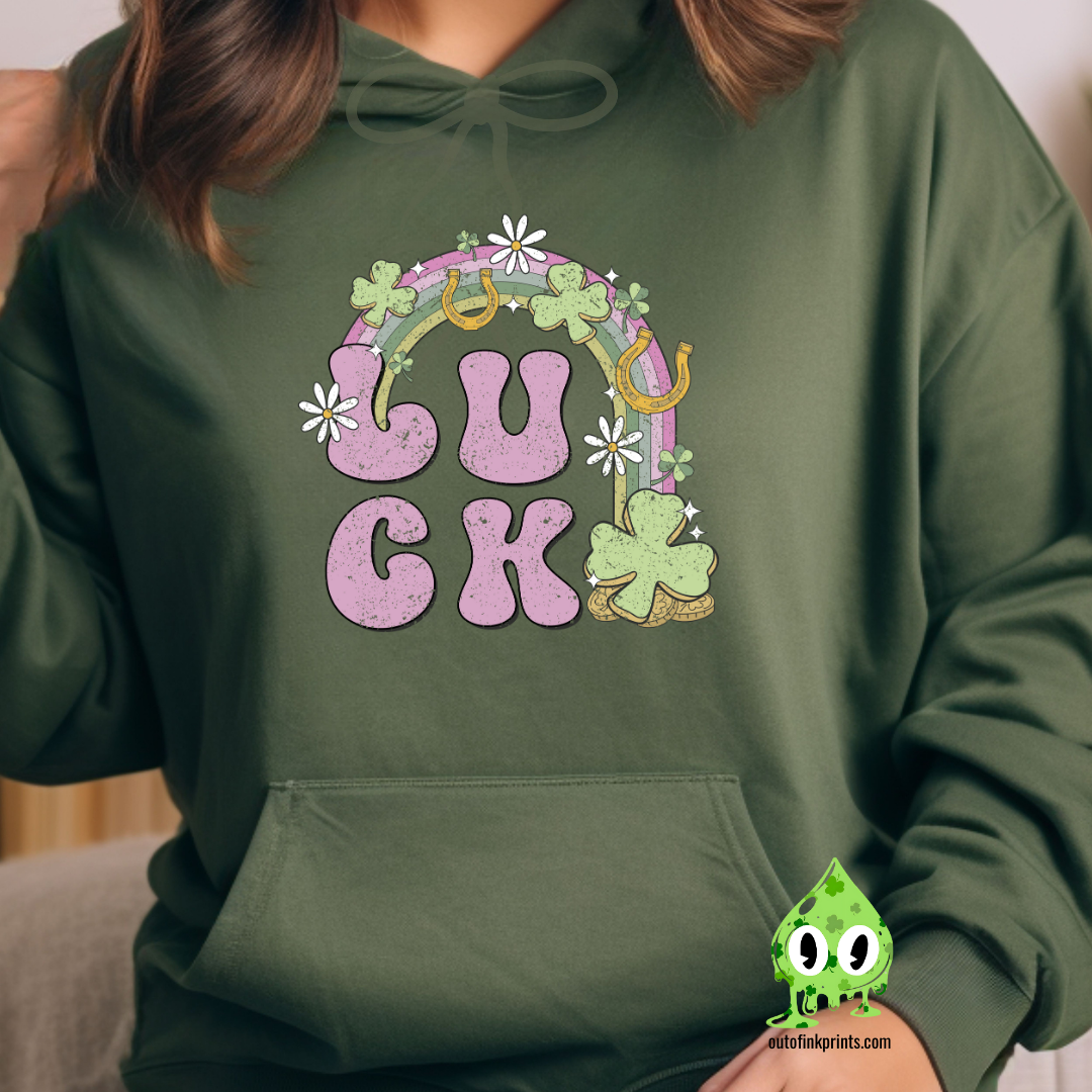 Front view of a green hoodie with a graphic print that includes the word 'LUCK' and elements representing Irish culture, such as shamrocks and gold.