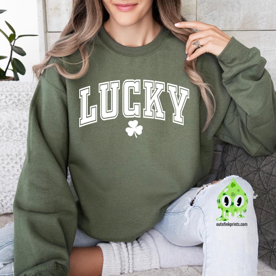 Front view of a green sweatshirt with the text 'LUCKY' and a four leaf clover on it.