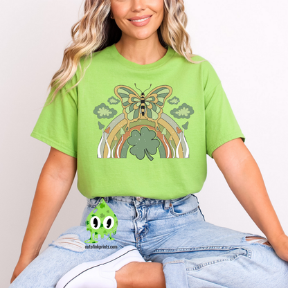 Front view of a green t-shirt with a graphic design of a butterfly and rainbows, predominantly in green color, celebrating St. Patrick's Day.