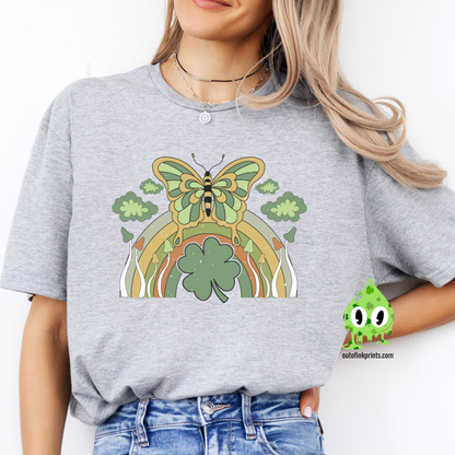 Front view of a gray t-shirt with a graphic design of a butterfly and rainbows, predominantly in green color, celebrating St. Patrick's Day.