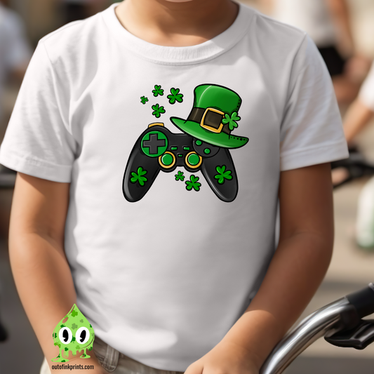 a white t-shirt with a graphic design of a video game controller and shamrocks, indicative of St. Patrick's Day themes.