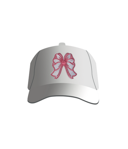 A white baseball cap with a pink and white heart-shaped bow patch on the front.