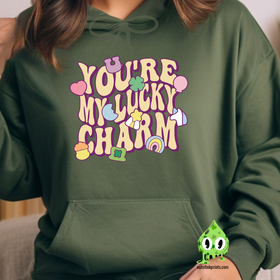 Green hoodie with 'YOU'RE MY LUCKY CHARM' text and clover graphics printed on the front.