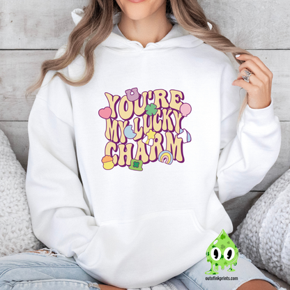 White hoodie with 'YOU'RE MY LUCKY CHARM' text and clover graphics printed on the front.