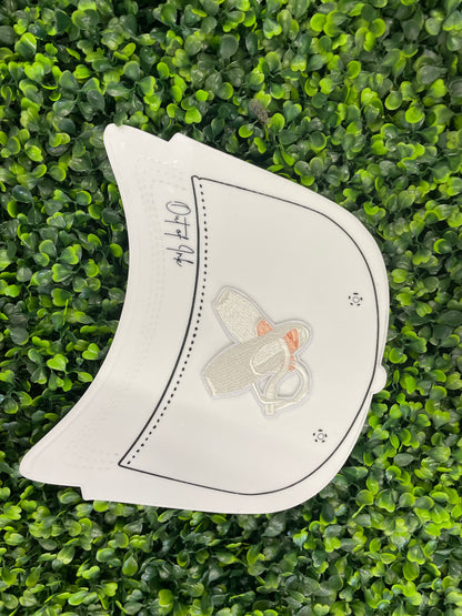Embroidered patch of a pair of ballet slippers placed onto a white trucker hat graphic